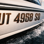 Custom Domed Carbon Fiber Boat Registration Numbers – Premium 3D Raised Decals with Bronze Trim