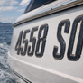 Custom Domed Carbon Fiber Boat Registration Numbers – Premium 3D Raised Decals with Bronze Trim