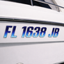 Boat with registration number FL 1638 JB on a white background