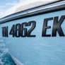  black raised 3D boat registration numbers on boat marine-grade 3D emblem